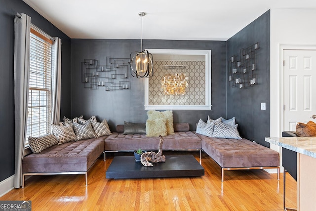 196 Mystic Ct, Atlanta, GA 30342 - living room with wood finished floors and a chandelier