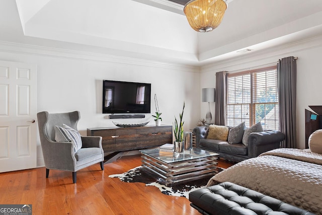 196 Mystic Ct, Atlanta, GA 30342 - living area featuring a raised ceiling, wood-type flooring, and crown molding