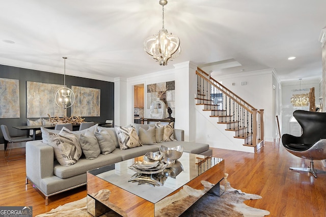 196 Mystic Ct, Atlanta, GA 30342 - living area with a chandelier, crown molding, stairway, wood finished floors, and recessed lighting