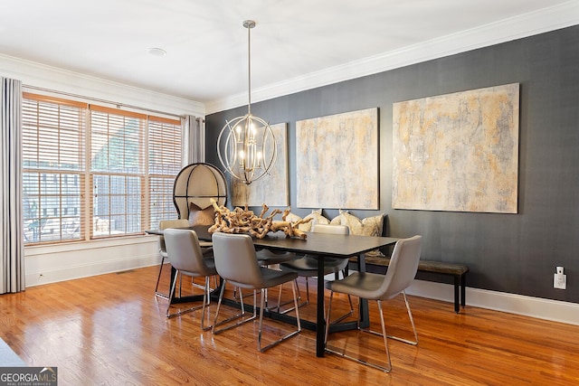 196 Mystic Ct, Atlanta, GA 30342 - dining area featuring a chandelier, crown molding, wood finished floors, and breakfast area