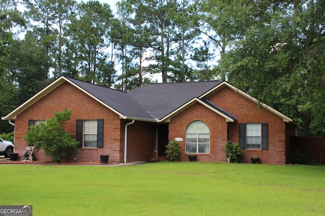 128 Youngblood Rd, Midway, GA 31320 - single story home with brick siding and a front lawn