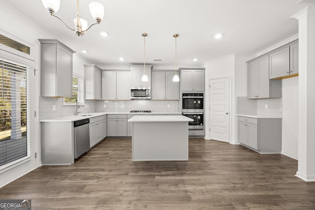 683 Edgar, Hampton, GA 30228 - kitchen featuring gray cabinets, stainless steel appliances, a kitchen island, recessed lighting, and tasteful backsplash