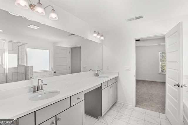 683 Edgar, Hampton, GA 30228 - bathroom with double vanity, plenty of natural light, a shower stall, and marble finish floors
