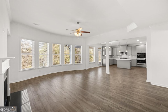 683 Edgar, Hampton, GA 30228 - unfurnished living room featuring ceiling fan, ornamental molding, dark wood-style floors, a fireplace with flush hearth, and recessed lighting