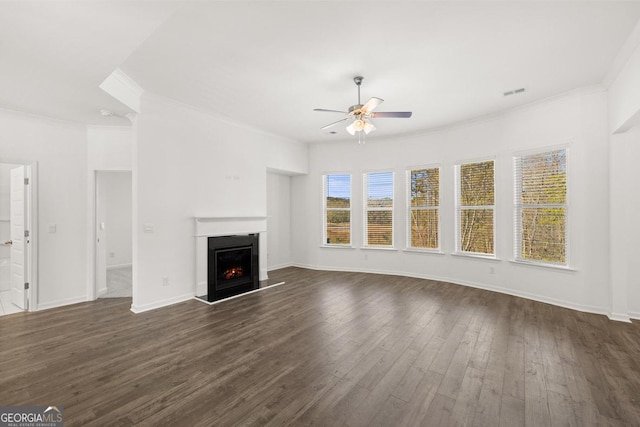 683 Edgar, Hampton, GA 30228 - unfurnished living room with ceiling fan, ornamental molding, dark wood-type flooring, and a lit fireplace