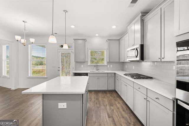683 Edgar, Hampton, GA 30228 - kitchen featuring stainless steel appliances, gray cabinets, dark wood-style floors, light countertops, and ornamental molding