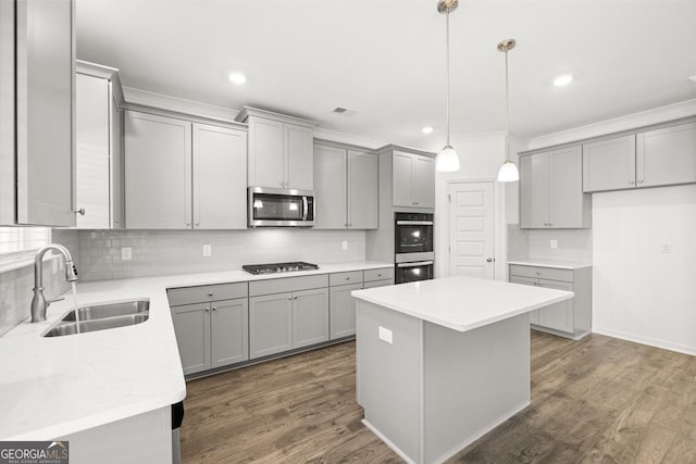 683 Edgar, Hampton, GA 30228 - kitchen with stainless steel appliances, gray cabinets, decorative backsplash, a center island, and crown molding