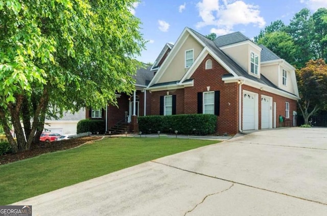 3737 Falls Trl, Winston, GA 30187 - view of front of house featuring driveway, brick siding, a front lawn, an attached garage, and stucco siding