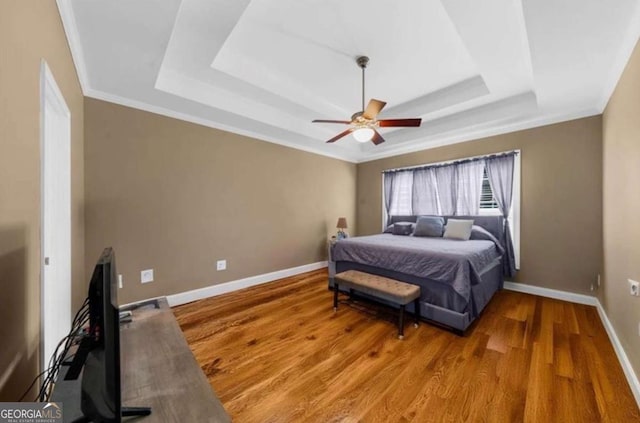 3737 Falls Trl, Winston, GA 30187 - bedroom featuring a raised ceiling, wood finished floors, ornamental molding, and a ceiling fan