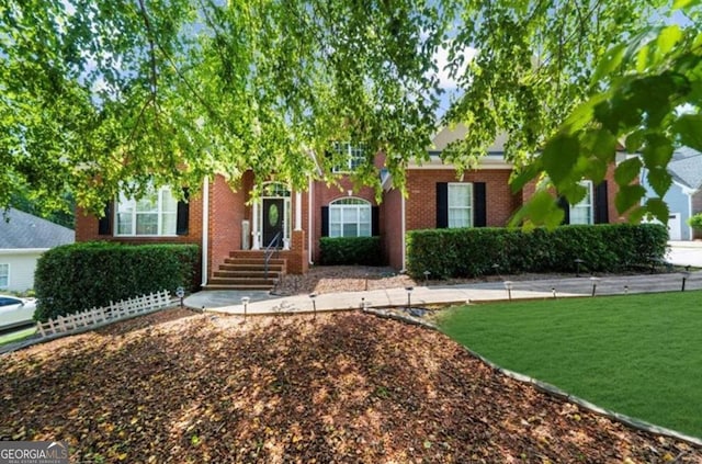 3737 Falls Trl, Winston, GA 30187 - view of property hidden behind natural elements with brick siding and a front yard