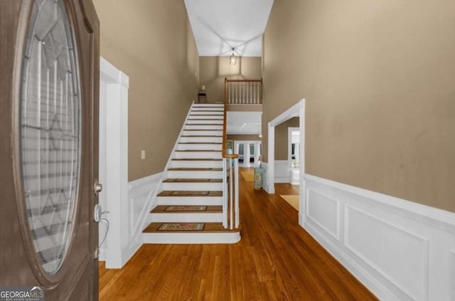 3737 Falls Trl, Winston, GA 30187 - foyer with a decorative wall, a wainscoted wall, wood finished floors, and stairs