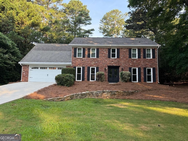 3375 Rivendell Ct, Roswell, GA 30075 - colonial house with driveway, brick siding, a front lawn, and a garage