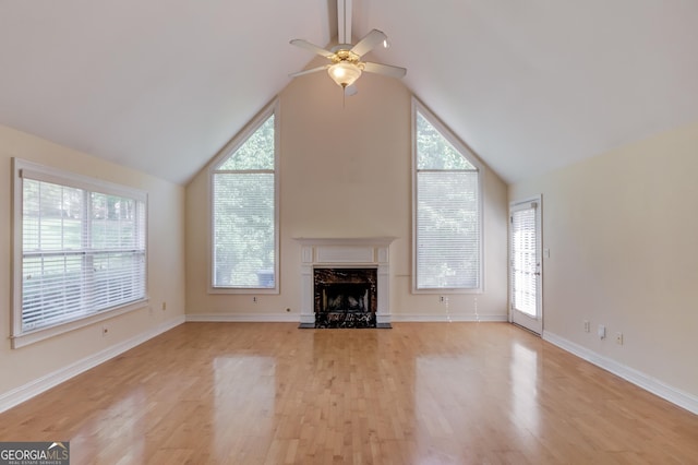805 River Vly, Dacula, GA 30019 - unfurnished living room featuring a ceiling fan, plenty of natural light, light wood finished floors, and vaulted ceiling