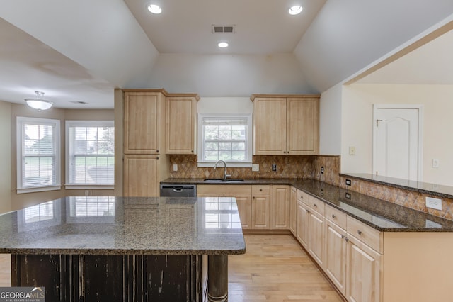 805 River Vly, Dacula, GA 30019 - kitchen featuring light brown cabinets, light wood-type flooring, a peninsula, lofted ceiling, and dark stone countertops
