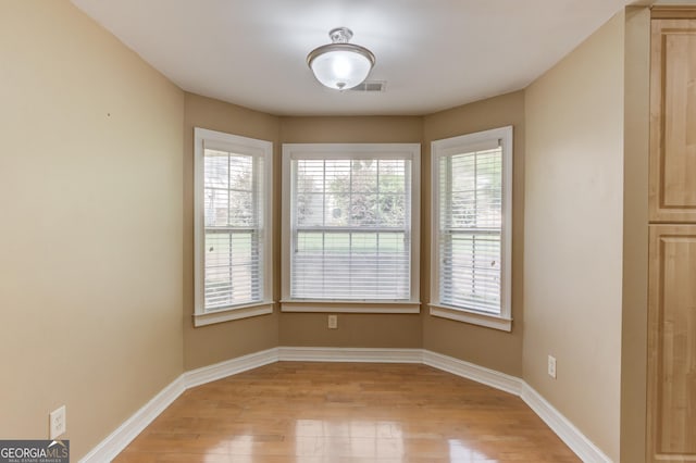 805 River Vly, Dacula, GA 30019 - unfurnished dining area featuring light wood-type flooring and healthy amount of natural light