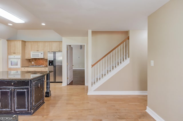 805 River Vly, Dacula, GA 30019 - kitchen featuring white appliances, light wood-type flooring, dark stone counters, backsplash, and recessed lighting