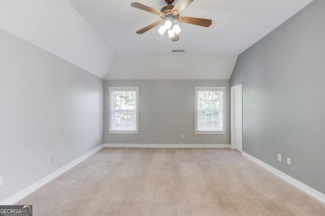 805 River Vly, Dacula, GA 30019 - spare room featuring a ceiling fan, lofted ceiling, and light colored carpet