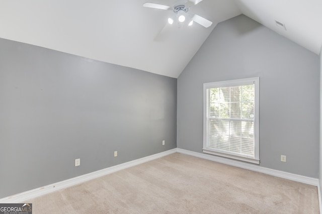 805 River Vly, Dacula, GA 30019 - spare room with vaulted ceiling, a ceiling fan, and light colored carpet