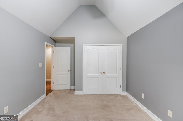 805 River Vly, Dacula, GA 30019 - unfurnished bedroom with light carpet, a closet, and high vaulted ceiling