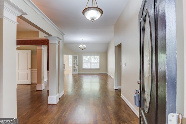 805 River Vly, Dacula, GA 30019 - foyer featuring ornate columns, dark wood finished floors, and a chandelier