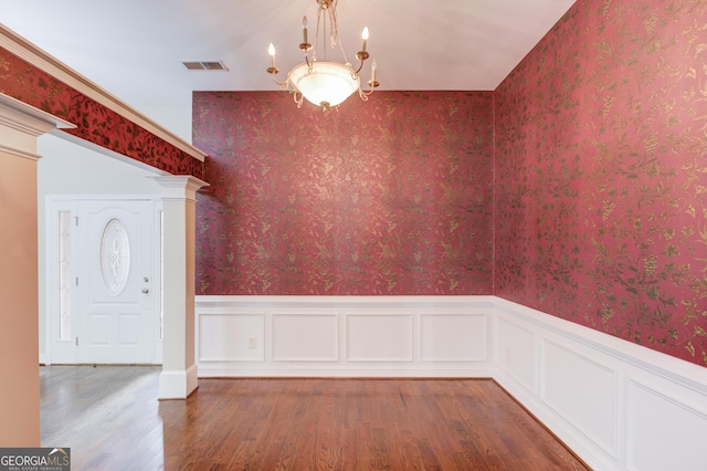 805 River Vly, Dacula, GA 30019 - unfurnished dining area with wood finished floors, wainscoting, and a chandelier