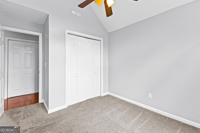 80 Austin Woods Dr, Senoia, GA 30276 - unfurnished bedroom featuring carpet flooring, lofted ceiling, a closet, and a ceiling fan