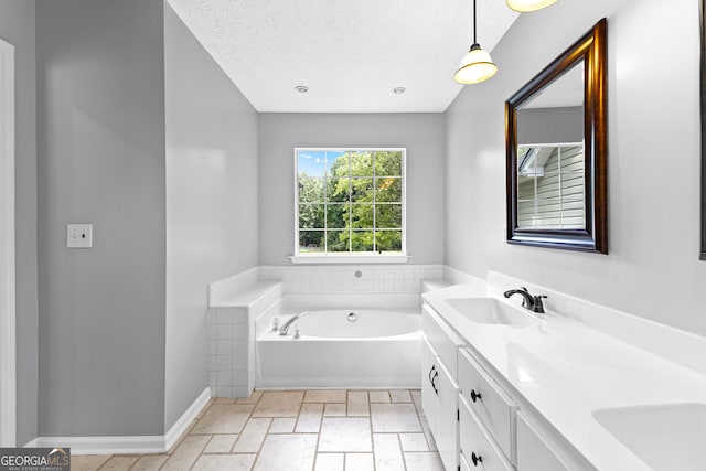 80 Austin Woods Dr, Senoia, GA 30276 - bathroom featuring double vanity, a bath, a textured ceiling, and stone tile floors
