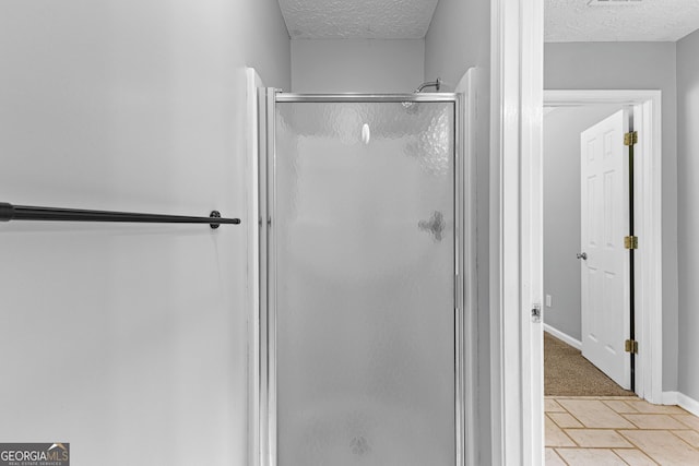 80 Austin Woods Dr, Senoia, GA 30276 - bathroom featuring a textured ceiling and a shower stall