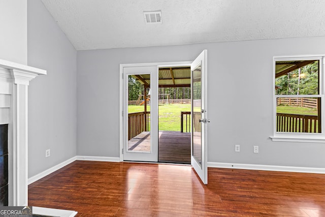 80 Austin Woods Dr, Senoia, GA 30276 - entrance foyer featuring lofted ceiling, a textured ceiling, plenty of natural light, and wood finished floors