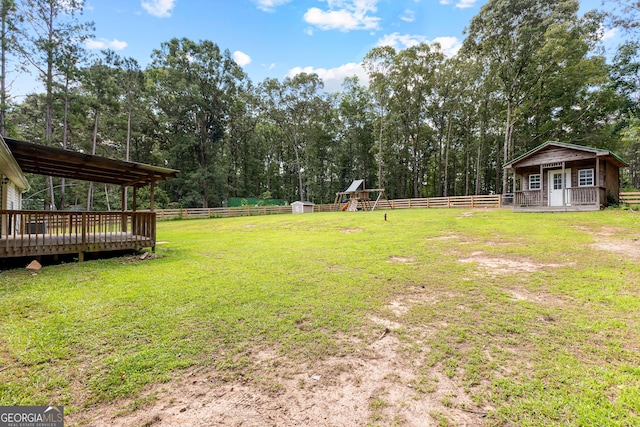 80 Austin Woods Dr, Senoia, GA 30276 - view of yard featuring an outbuilding, a deck, and a playground