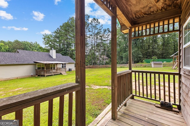 80 Austin Woods Dr, Senoia, GA 30276 - wooden deck with a lawn and view of wooded area