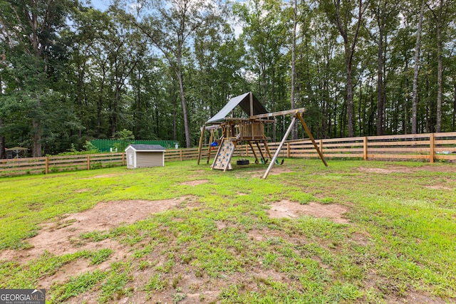 80 Austin Woods Dr, Senoia, GA 30276 - fenced backyard with a playground and a storage unit