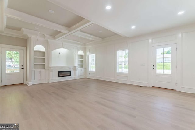 540 Sunset Ave, Comer, GA 30629 - unfurnished living room featuring light wood finished floors, beamed ceiling, a glass covered fireplace, built in features, and recessed lighting