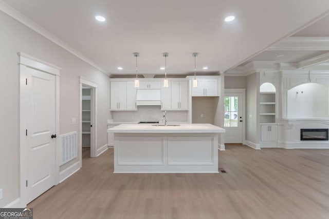 540 Sunset Ave, Comer, GA 30629 - kitchen featuring crown molding, white cabinets, recessed lighting, light wood-style floors, and light countertops