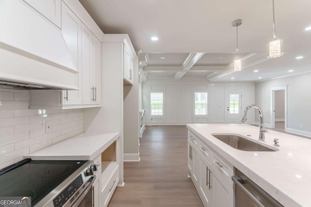 540 Sunset Ave, Comer, GA 30629 - kitchen with custom range hood, white cabinetry, tasteful backsplash, light wood-type flooring, and recessed lighting