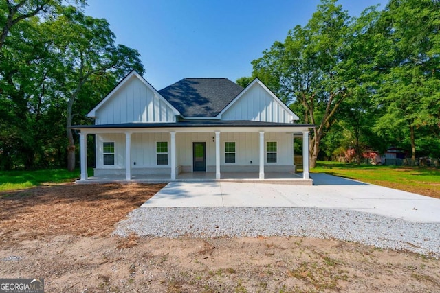 540 Sunset Ave, Comer, GA 30629 - modern inspired farmhouse with board and batten siding, covered porch, driveway, and a shingled roof