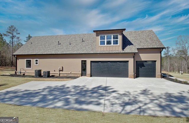 194 Forest Berry Ct Unit 98M2, Newnan, GA 30265 - view of property exterior with concrete driveway, a garage, roof with shingles, and board and batten siding