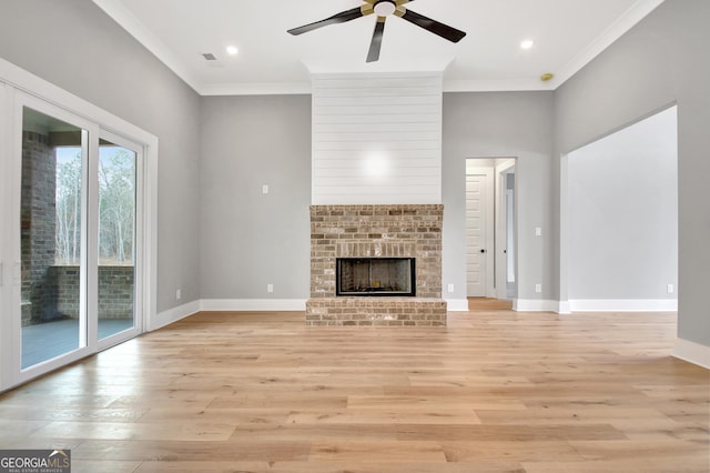 194 Forest Berry Ct Unit 98M2, Newnan, GA 30265 - unfurnished living room featuring light wood-style flooring, ornamental molding, ceiling fan, a fireplace, and recessed lighting
