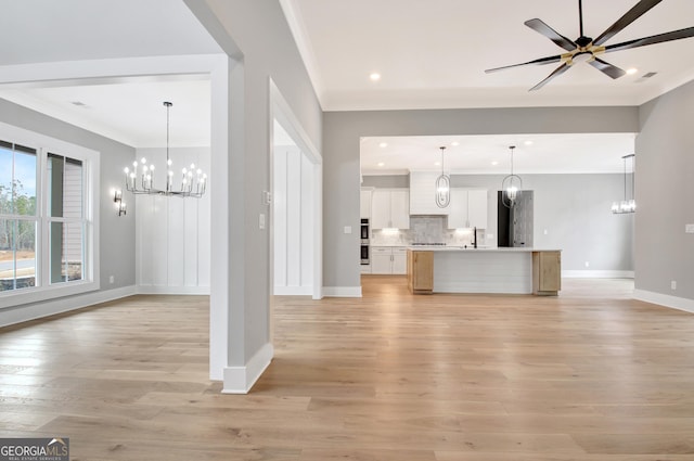 194 Forest Berry Ct Unit 98M2, Newnan, GA 30265 - unfurnished living room with a chandelier, light wood finished floors, ornamental molding, recessed lighting, and ceiling fan