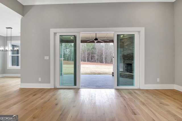194 Forest Berry Ct Unit 98M2, Newnan, GA 30265 - entryway with ceiling fan, wood finished floors, and a chandelier