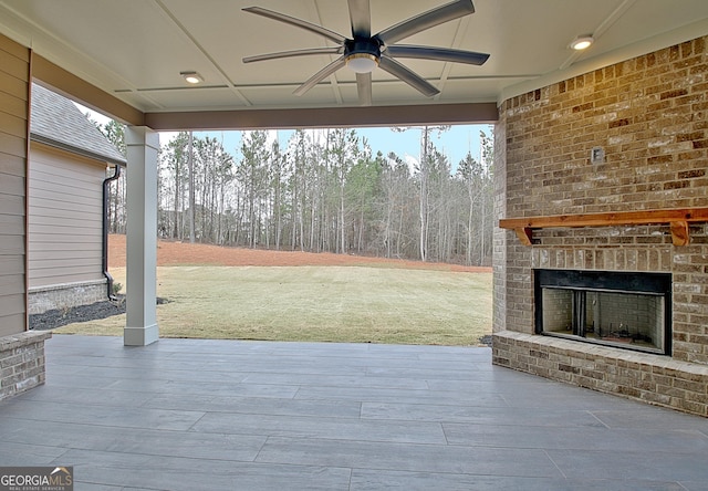 194 Forest Berry Ct Unit 98M2, Newnan, GA 30265 - view of patio / terrace featuring an outdoor brick fireplace, a ceiling fan, and a wooden deck