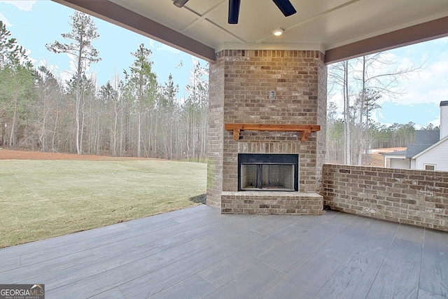 194 Forest Berry Ct Unit 98M2, Newnan, GA 30265 - view of patio featuring an outdoor brick fireplace and a ceiling fan