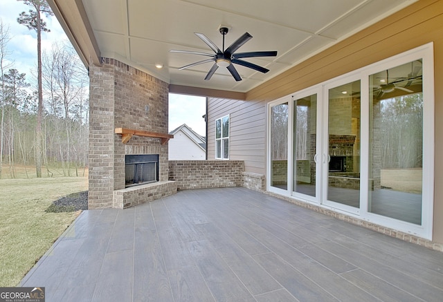 194 Forest Berry Ct Unit 98M2, Newnan, GA 30265 - view of patio / terrace featuring an outdoor brick fireplace and ceiling fan