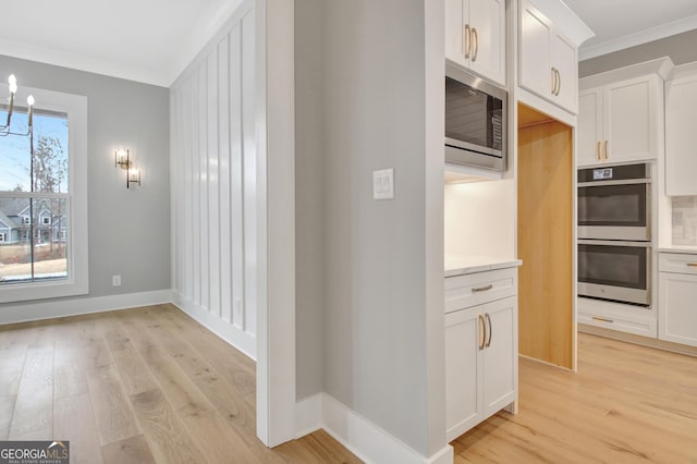 194 Forest Berry Ct Unit 98M2, Newnan, GA 30265 - hallway featuring ornamental molding and light wood finished floors