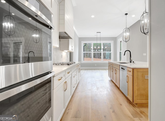 194 Forest Berry Ct Unit 98M2, Newnan, GA 30265 - kitchen featuring a chandelier, stainless steel appliances, custom exhaust hood, light wood-style flooring, and recessed lighting