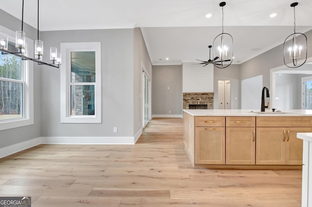 194 Forest Berry Ct Unit 98M2, Newnan, GA 30265 - kitchen with a chandelier, open floor plan, light wood finished floors, light countertops, and recessed lighting