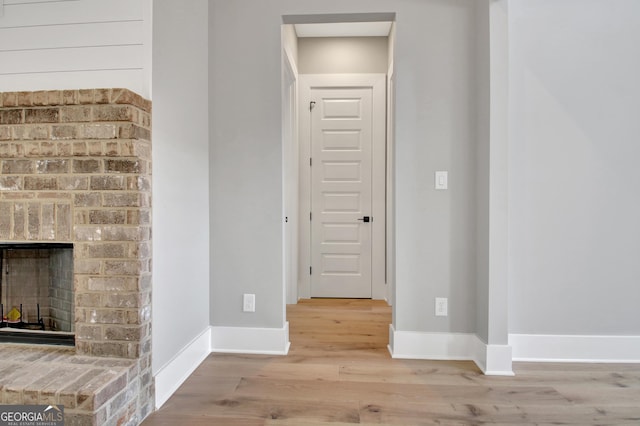 194 Forest Berry Ct Unit 98M2, Newnan, GA 30265 - unfurnished living room featuring wood finished floors and a fireplace