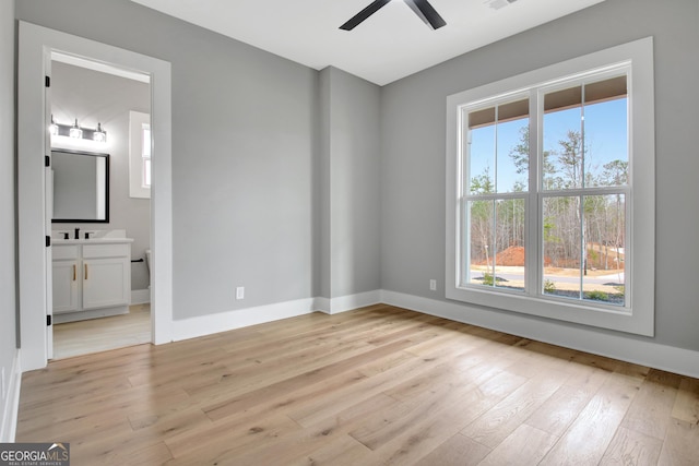 194 Forest Berry Ct Unit 98M2, Newnan, GA 30265 - unfurnished room with light wood finished floors and a ceiling fan