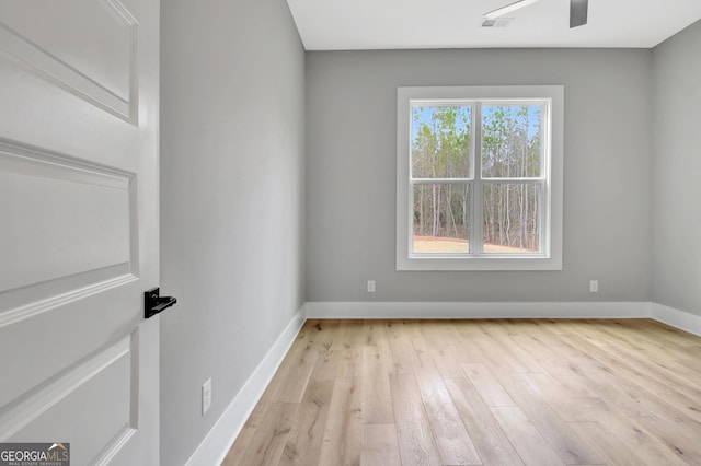 194 Forest Berry Ct Unit 98M2, Newnan, GA 30265 - empty room with light wood-style flooring and ceiling fan