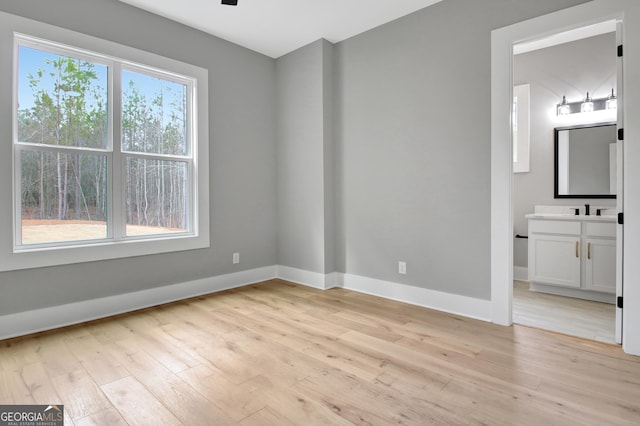 194 Forest Berry Ct Unit 98M2, Newnan, GA 30265 - empty room featuring light wood-style floors and a ceiling fan